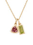 Gold necklace with two gemstone pendants on a white background