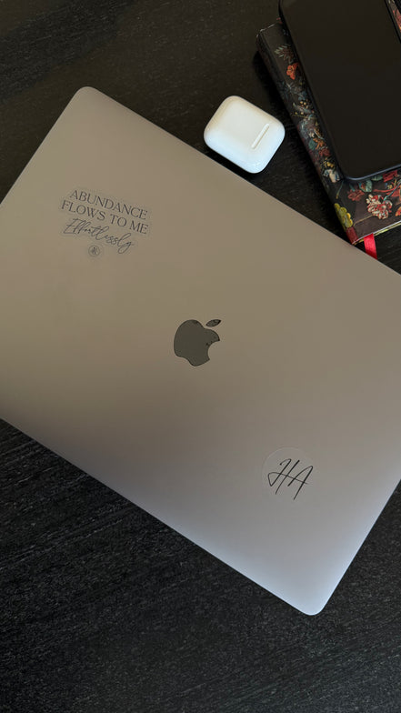 Silver laptop with Club affirmation by Hillary Alexandria on it