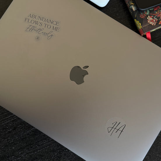 Silver laptop with Club affirmation by Hillary Alexandria on it