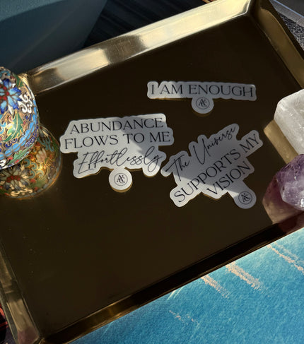 Decorative tray with motivational stickers on a blue surface