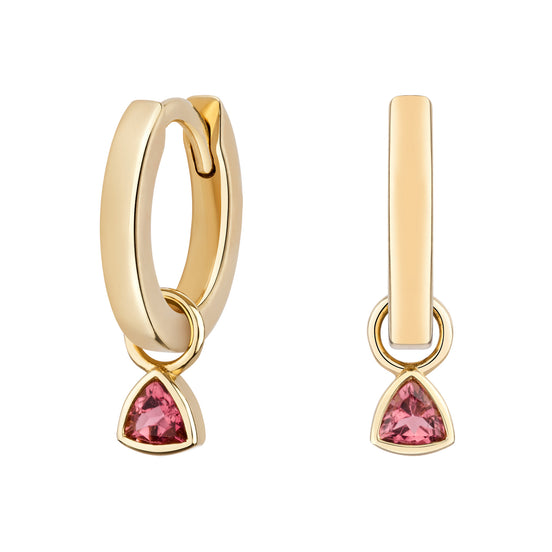 Gold hoop earrings with pink gemstones on a white background